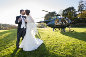 arrive in style wedding couple helicopter Pentillie Castle cornwall