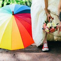 Colourful umbrella at outdoor wedding
