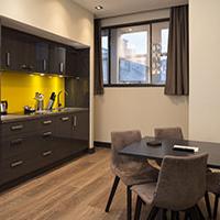 Roomzzzz aparthotels are ideal for a stag or hen party - lounge/kitchen area