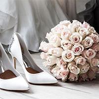 Wedding shoe and pink bouquet